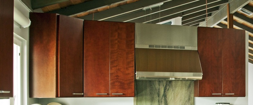 High-end Dura Supreme cabinets in classic cherry provided contrast with the countertops and flooring.