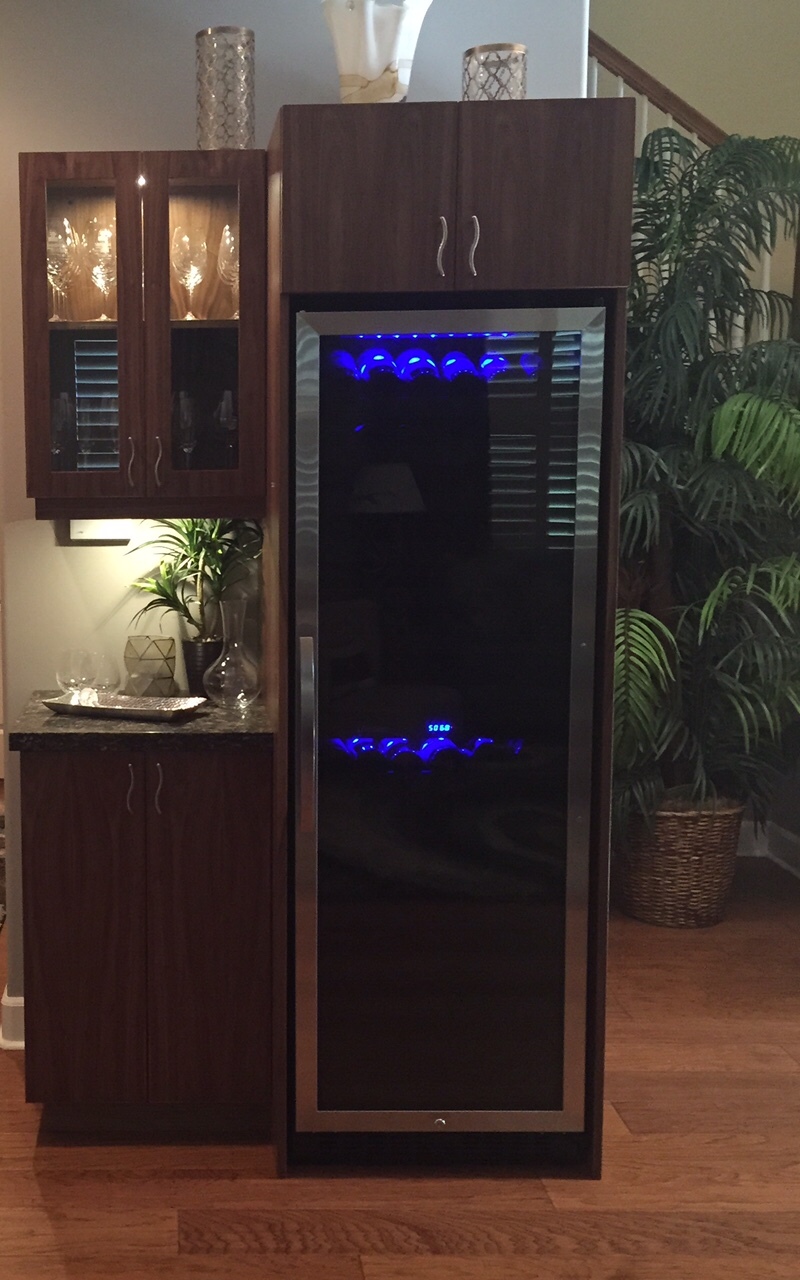 Custom cabinets designed to house a wine refrigerator and bottles of the good stuff. Click on the photo to learn more about Hawaii Kitchen & Bath.