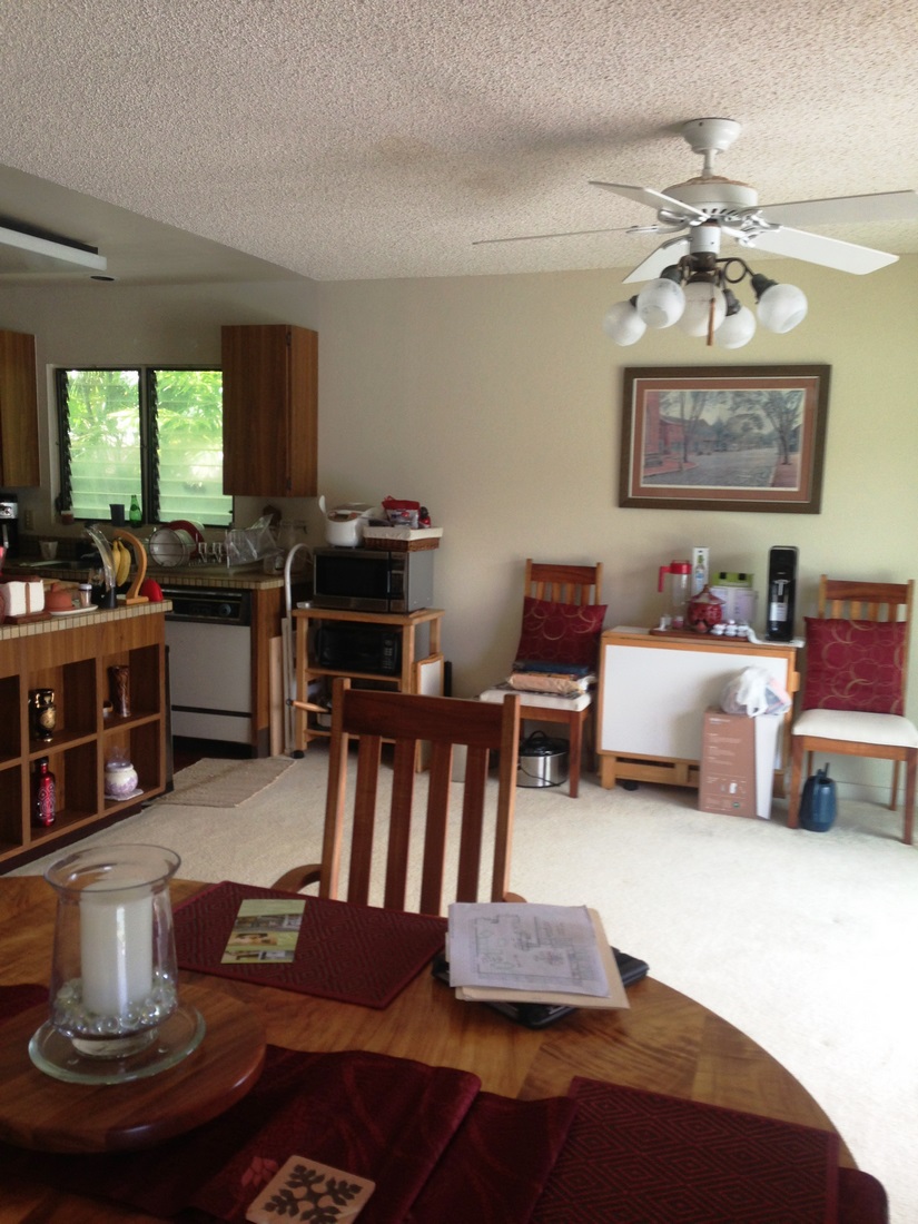 Before photo showing the corner position of the old kitchen and unused adjacent space.