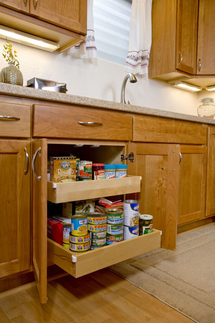 The use of roll-out trays was another innovative way of creating storage space in the kitchen remodel, providing more space for the kitchen.